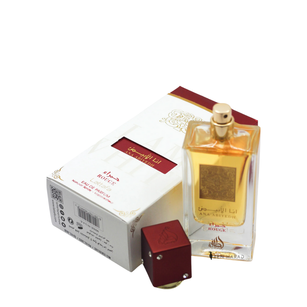 Ana Abiyedh Rouge perfume by Lattafa – luxurious Arabian fragrance showcased with its elegant box, featuring a golden label and rich amber liquid. 