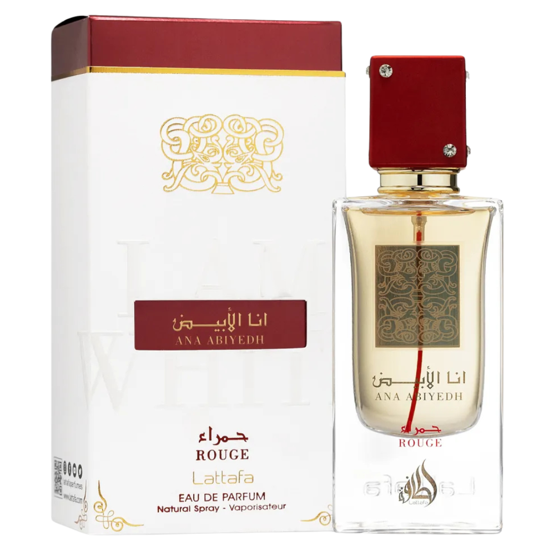 Lattafa Ana Abiyedh Rouge Eau de Parfum – premium Middle Eastern fragrance in a transparent glass bottle with gold detailing and matching white-and-red packaging. A bottle of Ana Abiyedh Rouge perfume by Lattafa with a clear glass body and a red cap, displaying the label and the fragrance name. Clone / dupe of / inspired by Maison Francis Kurkdjian - Baccarat Rouge 540 perfume.
