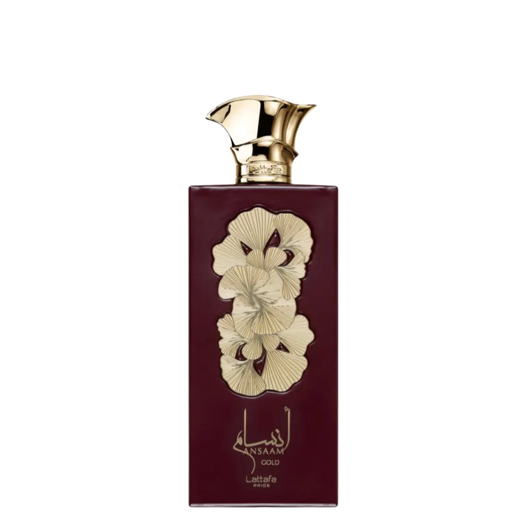 A bottle of Ansaam Gold Perfume with a dark maroon label and gold designs, including the name of the perfume in Arabic script and a decorative gold cap.