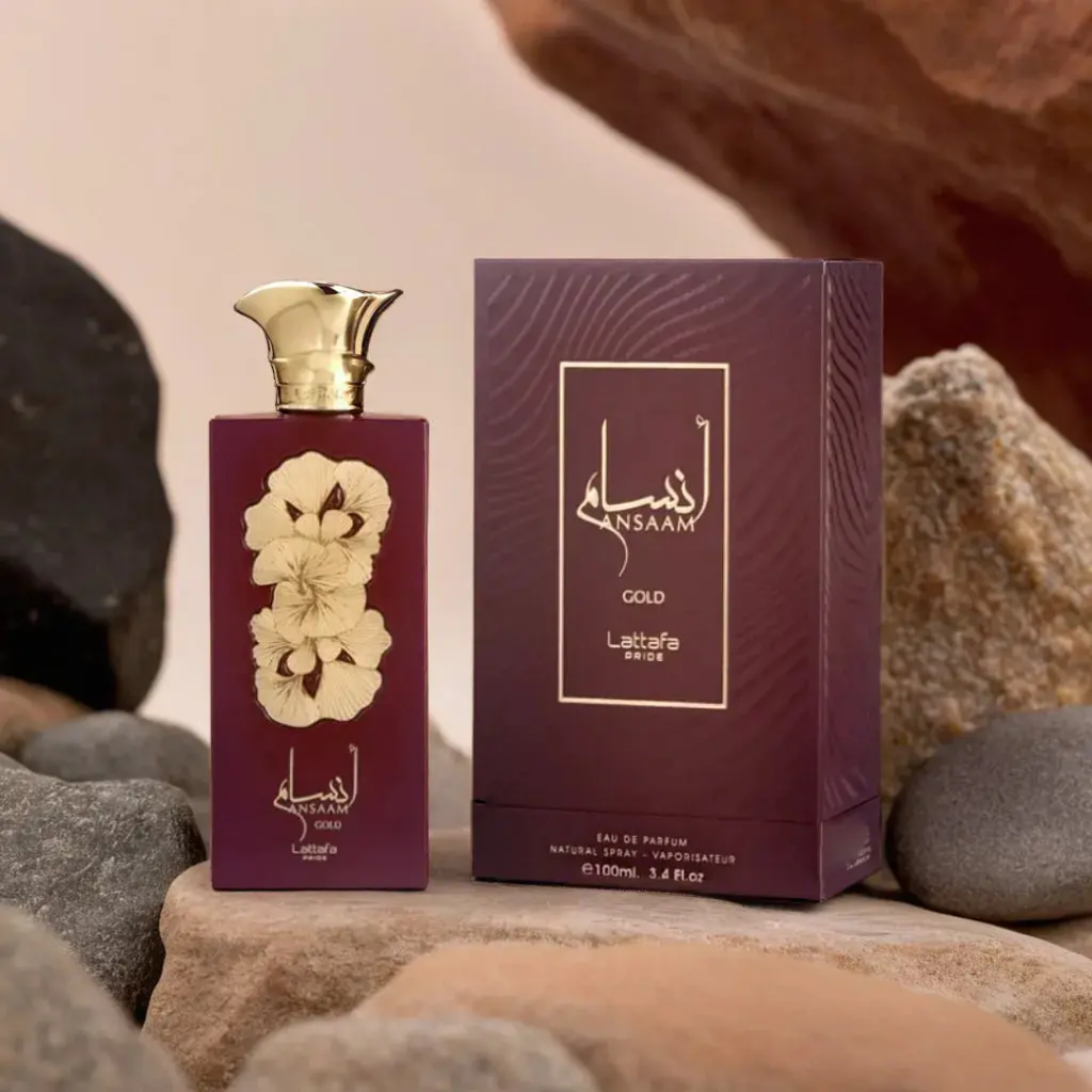 Perfume bottle and packaging on stones. Lattafa Ansaam Gold Womens Perfume
