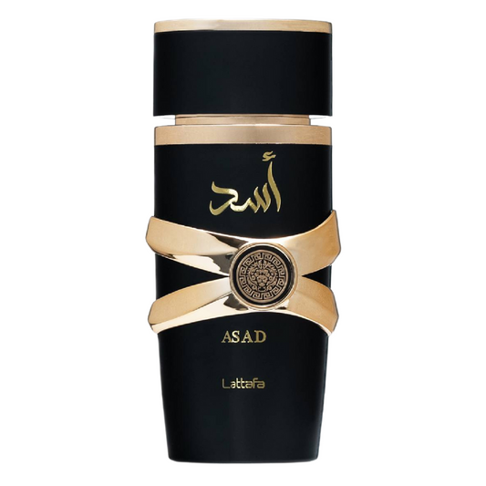A black bottle of Asad Perfume by Lattafa with gold accents and Arabic script on the label. Black and gold bottle of Asad by Lattafa Eau de Parfum – Luxury men’s fragrance in a matte black cylindrical bottle with golden Arabic script and gold crisscross band, 100ml. Clone / dupe of / inspired by Dior - Sauvage Elixir perfume.