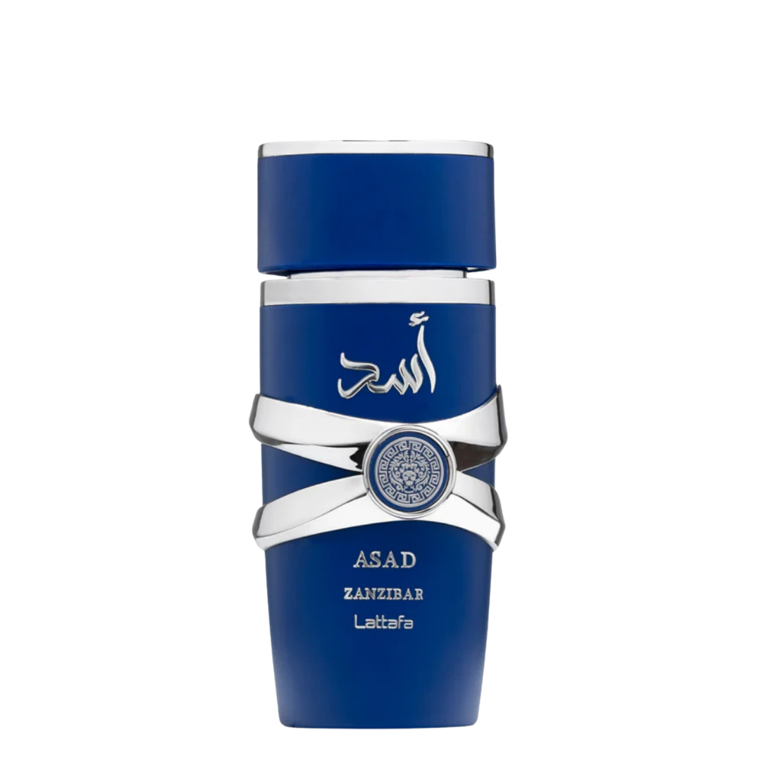 A blue perfume bottle with silver accents and a label with the brand name 'Asad Zanzibar' on it. Lattafa Asad Zanzibar Eau de Parfum bottle in royal blue with silver accents and Arabic calligraphy.