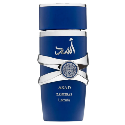 A blue perfume bottle with silver accents and a label with the brand name 'Asad Zanzibar' on it. Lattafa Asad Zanzibar Eau de Parfum bottle in royal blue with silver accents and Arabic calligraphy. Clone / dupe of / inspired by Jean Paul Gaultier - Le Beau perfume.