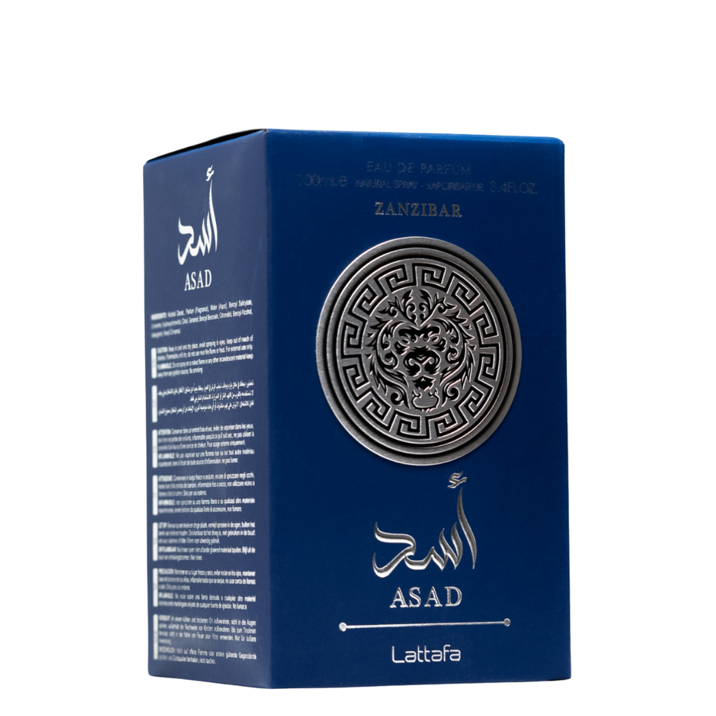 Lattafa Asad Zanzibar fragrance box in royal blue with embossed silver lion emblem and Arabic text. 
