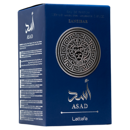 Lattafa Asad Zanzibar fragrance box in royal blue with embossed silver lion emblem and Arabic text. Clone / dupe of / inspired by Jean Paul Gaultier - Le Beau perfume.