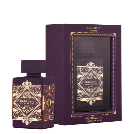 Perfume bottle and packaging with intricate designs on a white background. Lattafa Badee Al Amethyst Oud Unisex Perfume