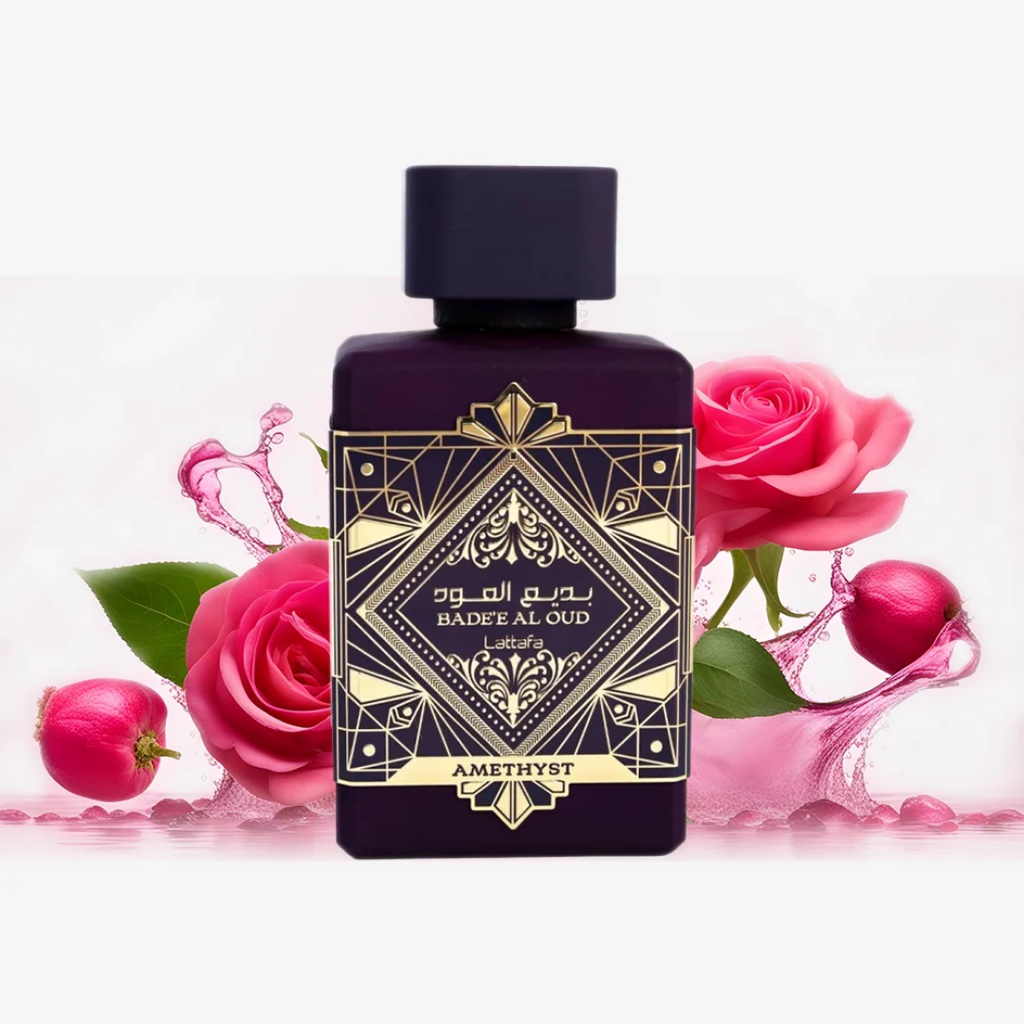 Perfume bottle with decorative design surrounded by pink roses and water splash. Lattafa Badee Al Amethyst Oud Unisex Perfume