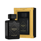 Black Exposed Badee Al Oud perfume bottle in front of its matching black and gold packaging box, on a clean white background.