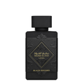 A rectangular black perfume bottle with a matching black cap, featuring gold Arabic and English lettering that reads 'BADEE AL OUD' and 'BLACK EXPOSED' on a clean white background.