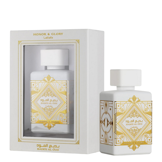 Perfume bottle with decorative gold patterns and packaging on a white background. Lattafa Badee Al Oud Honor & Glory Unisex Perfume