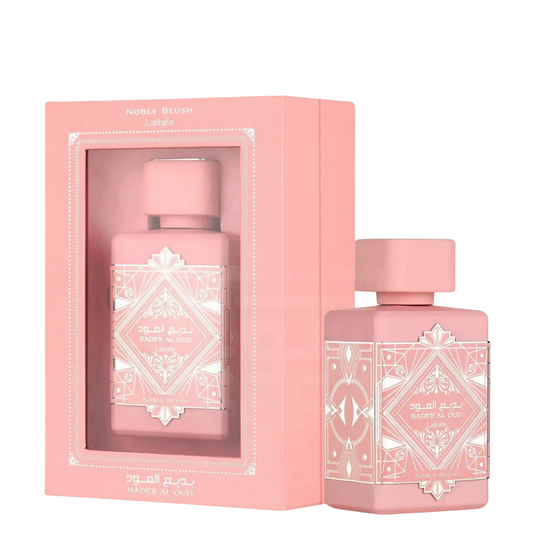 Pink perfume bottle with decorative packaging on a white background. Lattafa Badee Al Oud Noble Blush Unisex Perfume