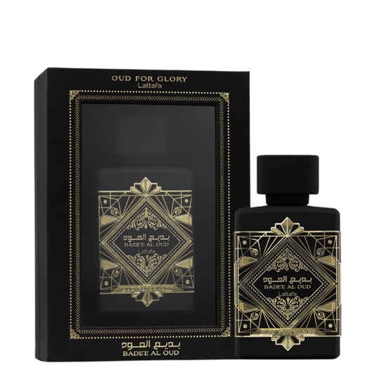Perfume bottle and packaging with intricate gold designs on a black background. Lattafa Badee Al Oud Unisex Perfume