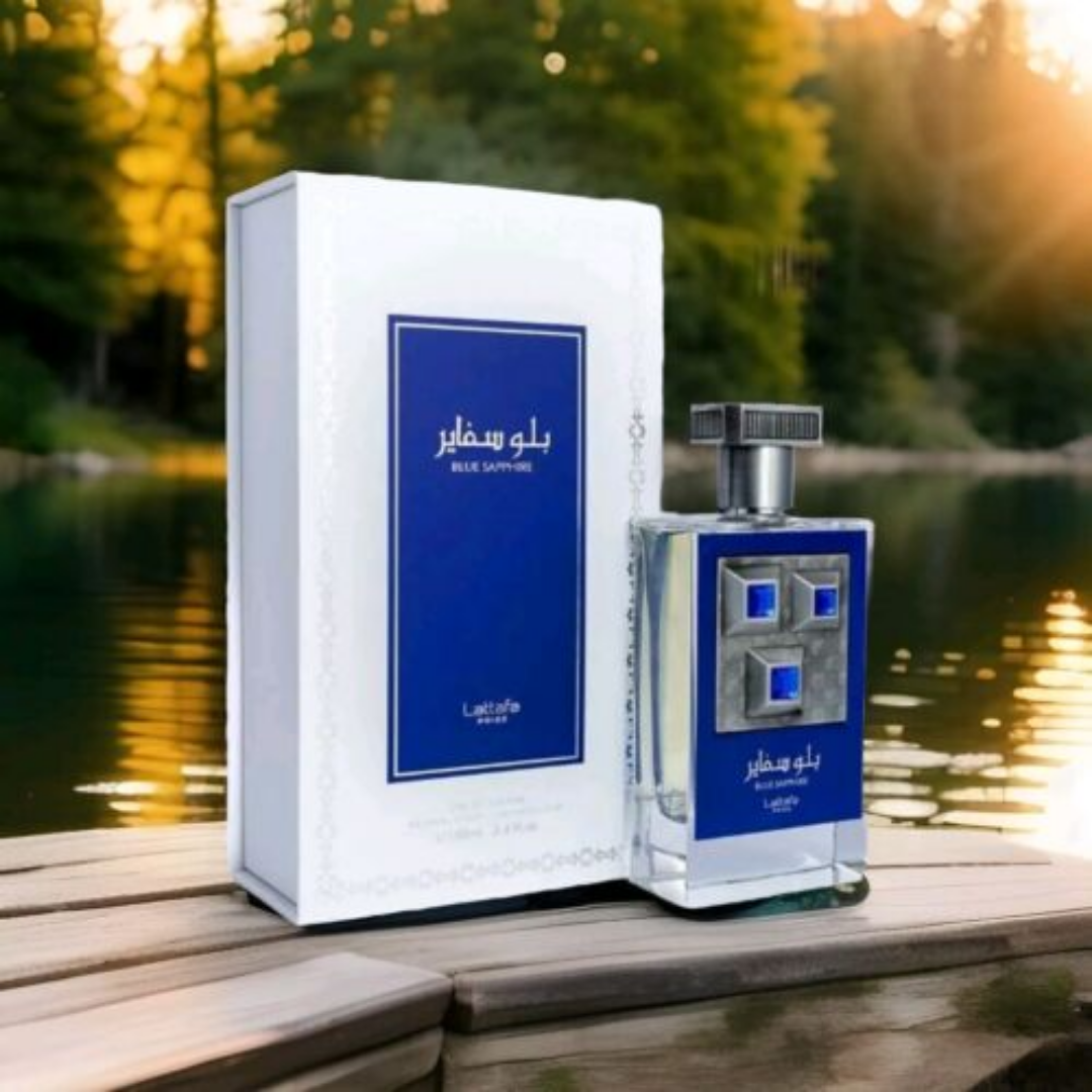 Perfume bottle and packaging with a scenic background. Lattafa Blue Sapphire Unisex Perfume