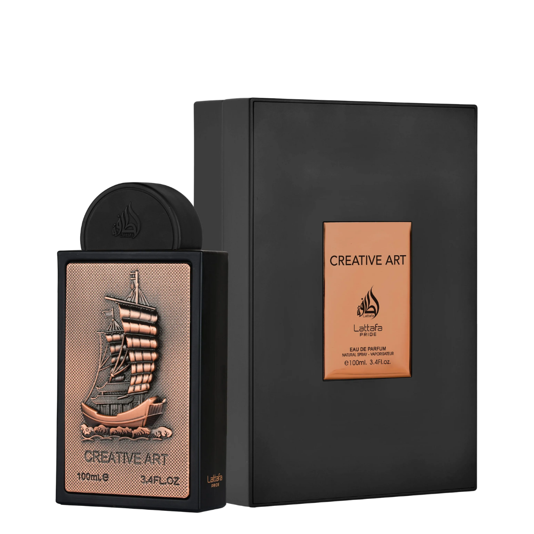 A bottle of Lattafa Creative Art Eau de Parfum next to its black presentation box, featuring a detailed bronze and copper-colored ship illustration on the bottle label.