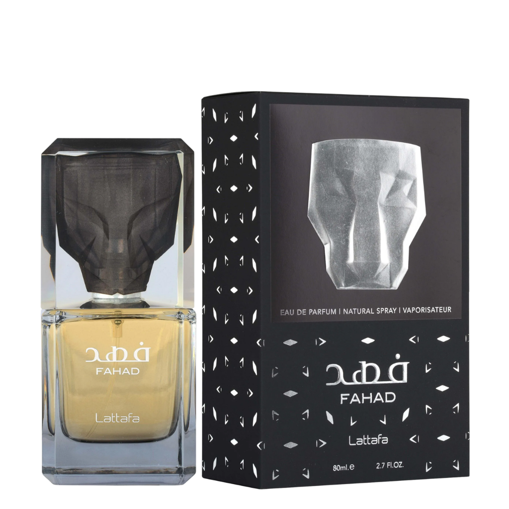 A bottle of FAHAD Lattafa Eau de Parfum with a faceted clear cap and golden-yellow liquid, shown next to its black packaging box with white geometric patterns.