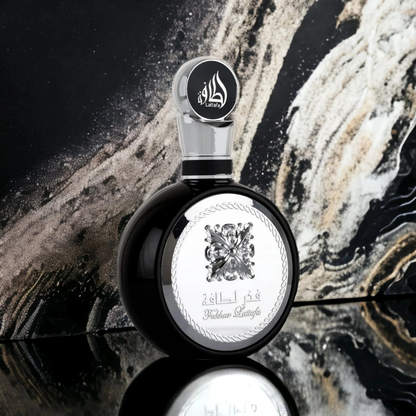Lattafa Fakhar Black Perfume Bottle on Marble Background – Luxury Men’s Fragrance
Striking Lattafa Fakhar Black perfume displayed against a marble-inspired background, symbolizing elegance and power in a masculine scent. Clone / dupe of / inspired by Yves Saint Laurent - Y perfume.