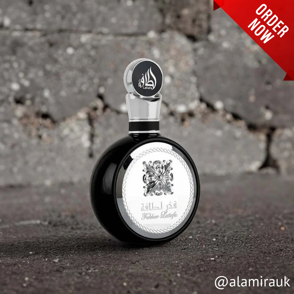 Perfume bottle with decorative label on a textured surface, 'Order Now' text overlay. 