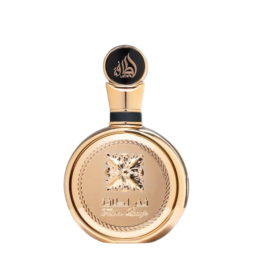 Fakhar Extrait by Lattafa Perfumes – luxurious gold fragrance bottle with intricate embossed design, premium Arabic perfume for men and women. 
