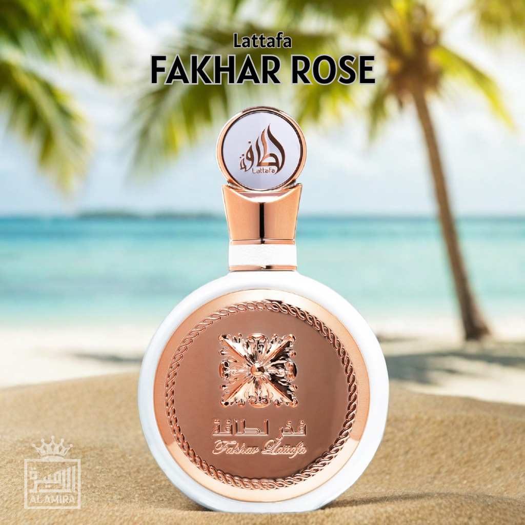 Lattafa Fakhar Rose perfume bottle on a beach with palm trees in the background. 