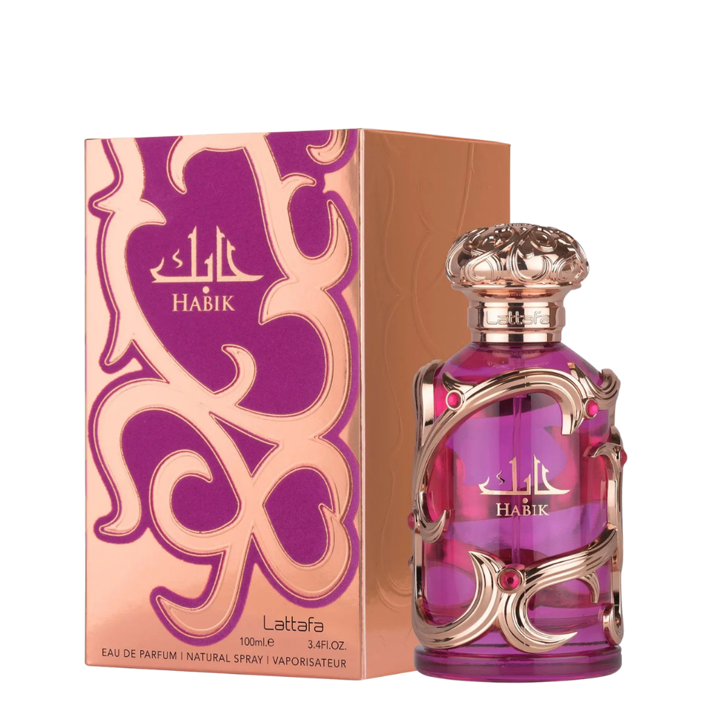 Habik Lattafa perfume bottle and its matching packaging box. The bottle is a translucent purple glass with ornate gold metal wrapping and a gold cap, while the box features a peach and purple abstract pattern.