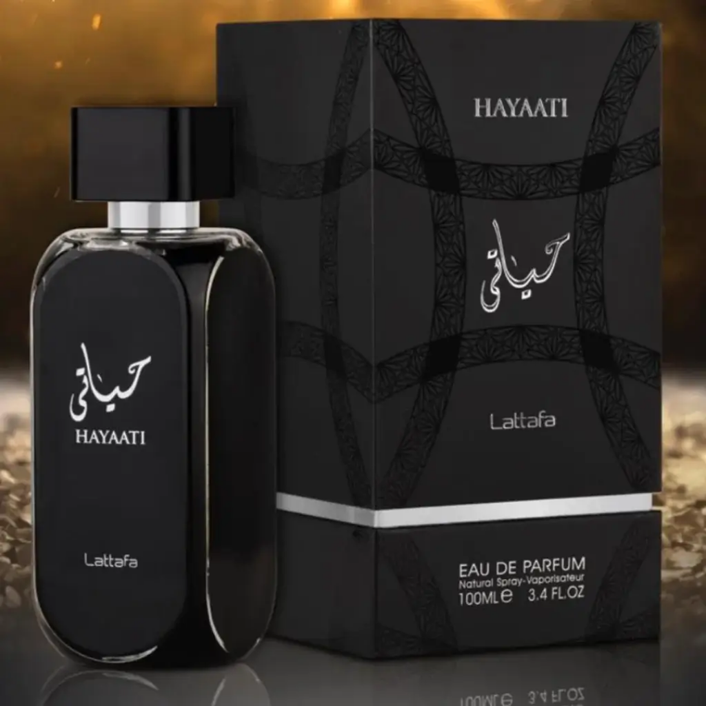 Black perfume bottle and packaging on a reflective surface. Lattafa Hayaati Unisex Perfume