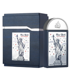 New York The City of Dreams Eau de Parfum bottle and its matching dark blue presentation box, both featuring a silver and white illustration of the Statue of Liberty.