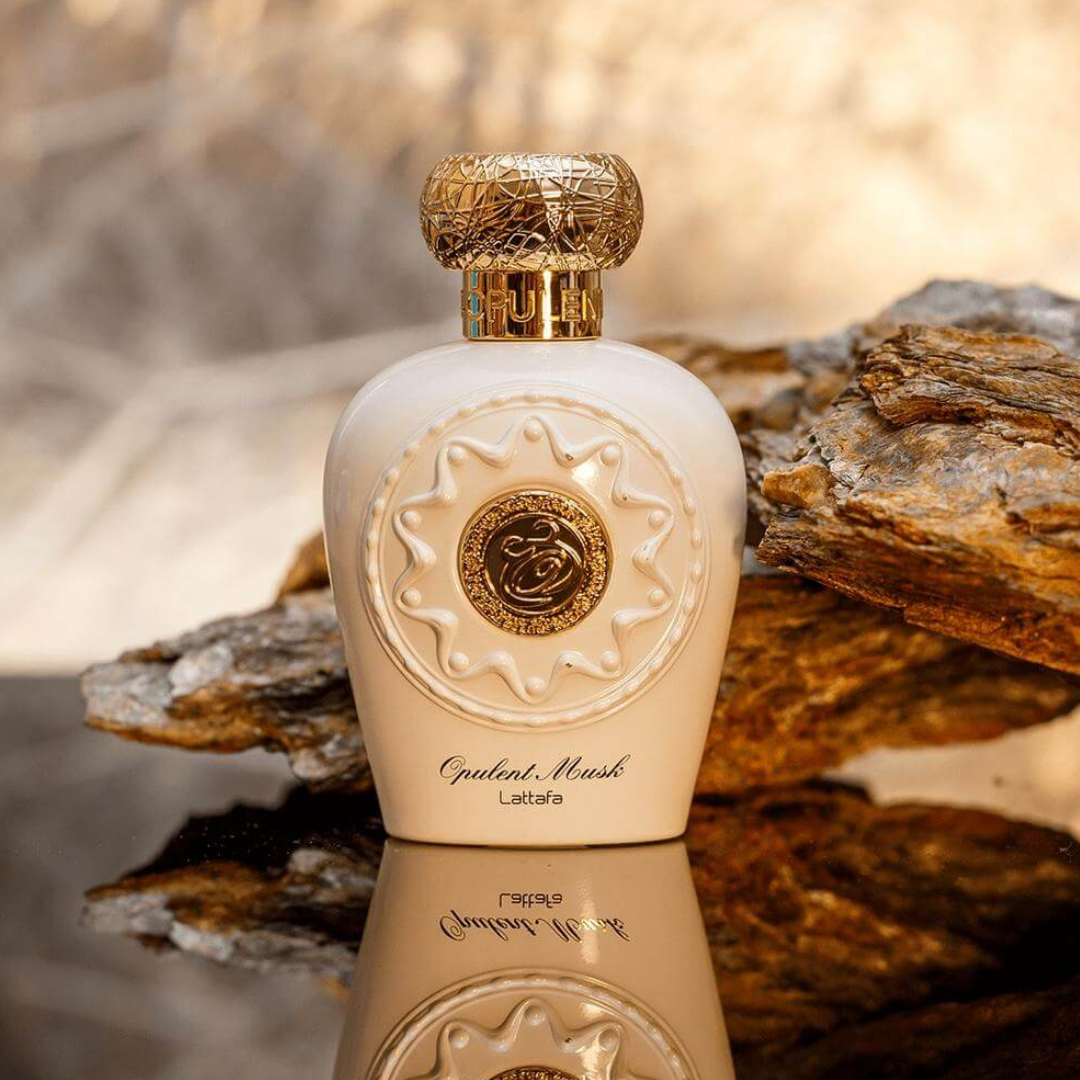 Perfume bottle with decorative lid on rocky surface. Lattafa Opulent Musk Womens Perfume