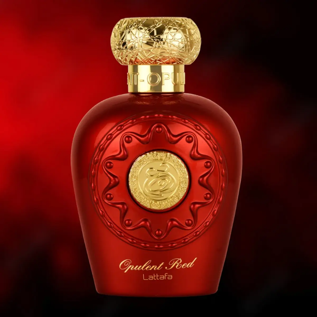 Red perfume bottle with gold detailing on a red background. Lattafa Opulent Red Unisex Perfume