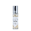 A small cylindrical glass roller bottle with a shiny silver cap and a white label featuring gold ornamental patterns and Arabic script, labeled Lattafa 'Pure Musk'.
