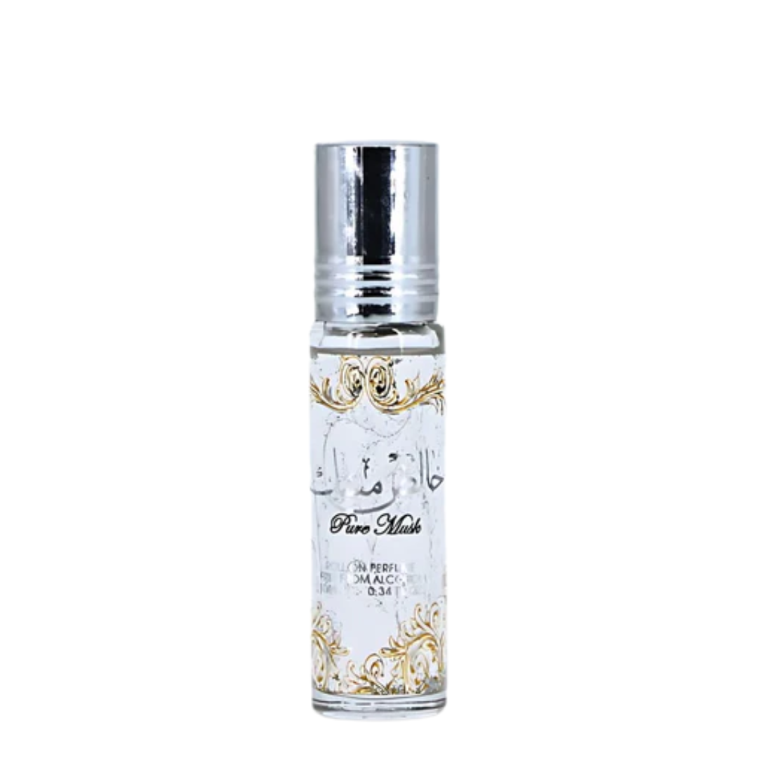 A small cylindrical glass roller bottle with a shiny silver cap and a white label featuring gold ornamental patterns and Arabic script, labeled Lattafa 'Pure Musk'.