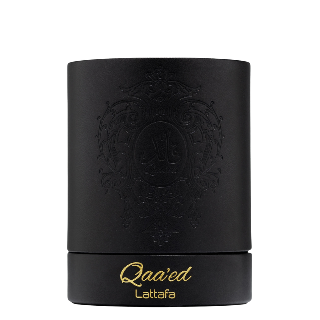 Elegant black cylindrical Lattafa Qaa’ed perfume box with gold embossed lettering and intricate Arabic design, representing high-end Arabian perfumery. 