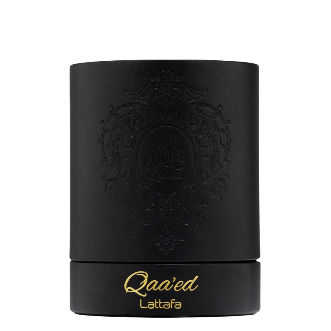 Elegant black cylindrical Lattafa Qaa’ed perfume box with gold embossed lettering and intricate Arabic design, representing high-end Arabian perfumery. 