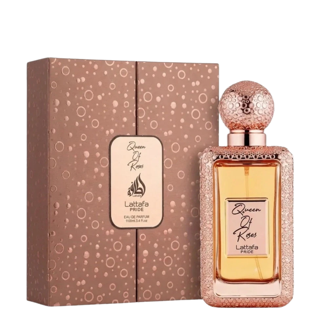 Queen Of Roses Lattafa Pride Eau De Parfum bottle with a textured rose gold cap, displayed next to its matching rose gold patterned packaging box on a white background.