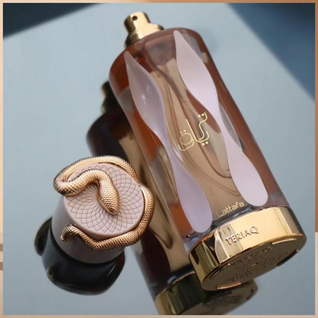 Perfume bottle with gold cap and decorative design on a reflective surface