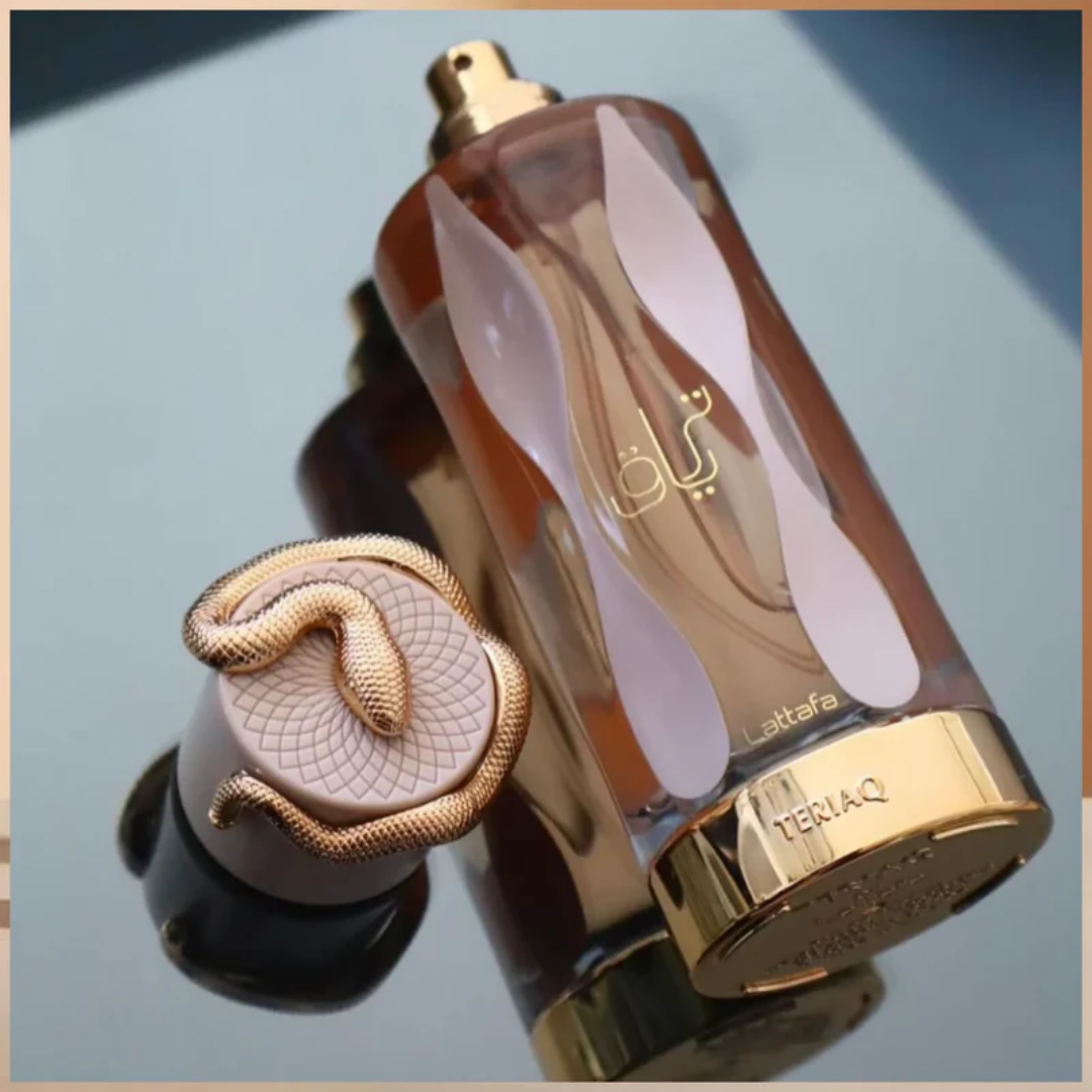 Perfume bottle with gold cap and decorative design on a reflective surface