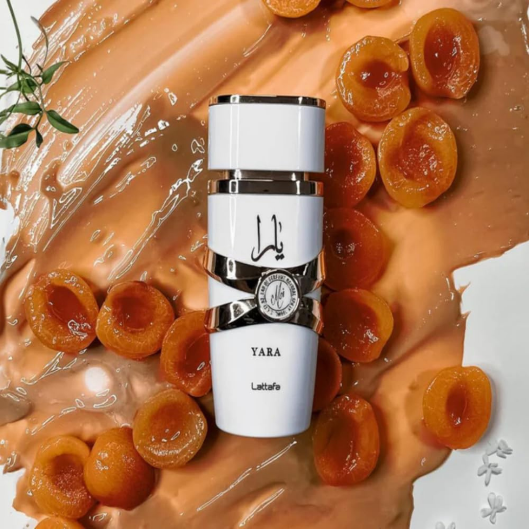 Lattafa Yara Moi perfume bottle with apricot and floral background – Fruity floral gourmand scent inspired by Marc Jacobs Perfect.