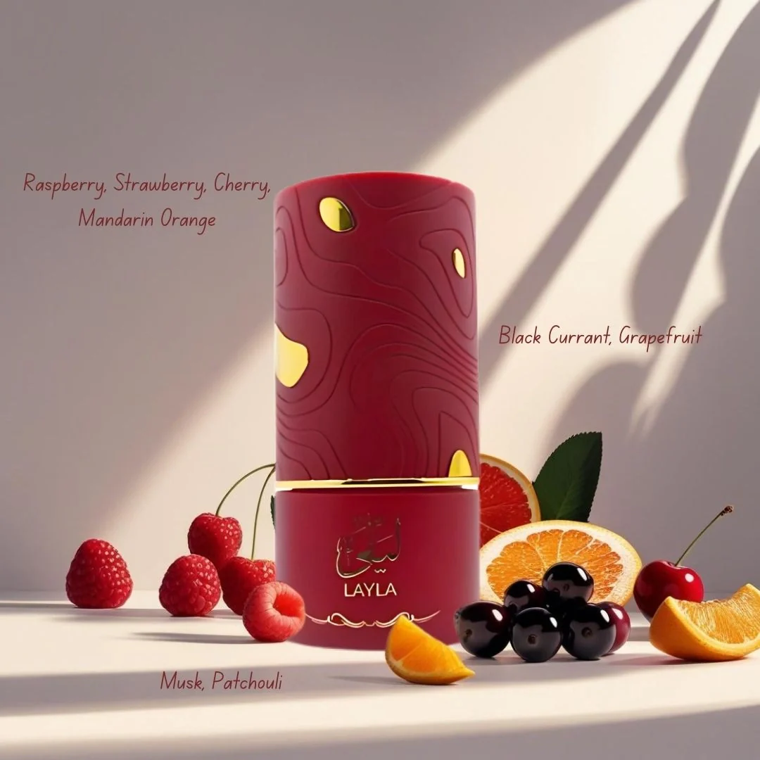 Red cylindrical container with gold accents on a light surface surrounded by fruits, featuring the brand 'LAYLA'.