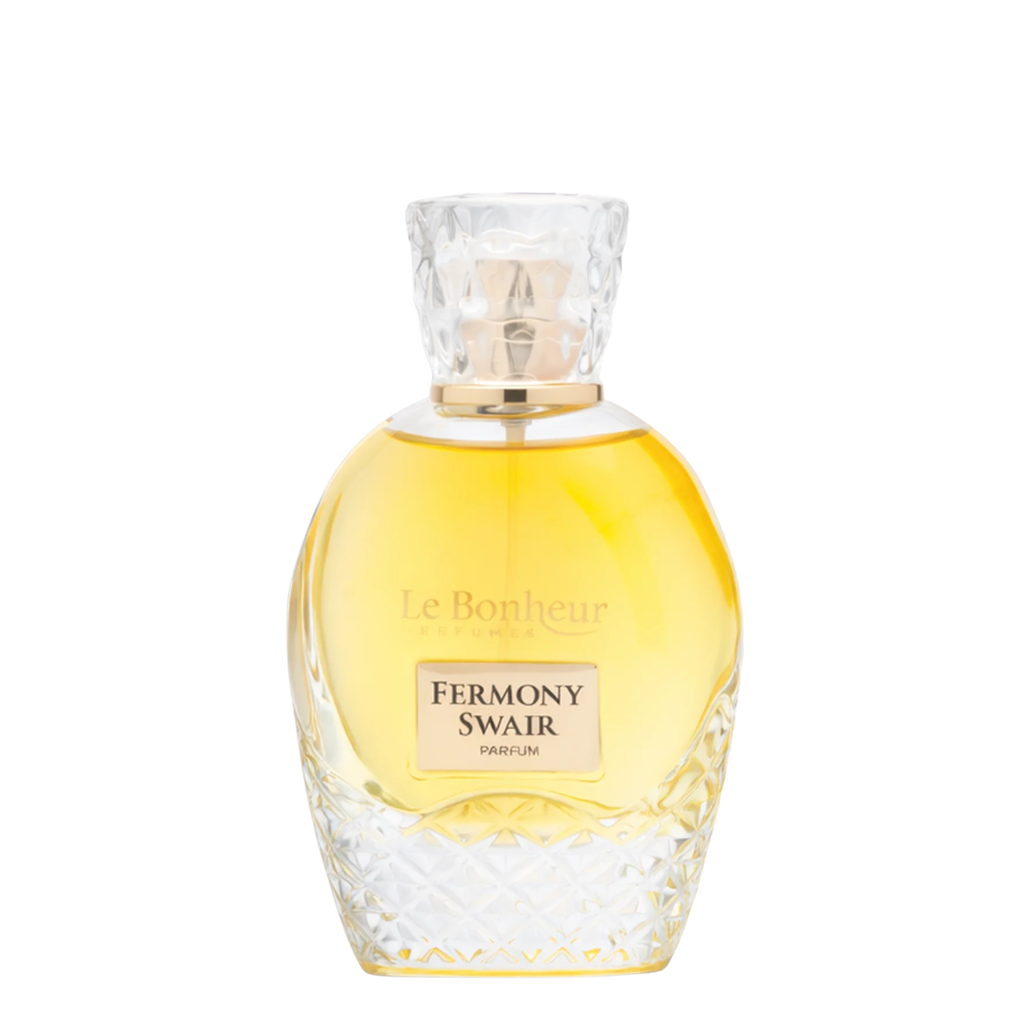A bottle of Le Bonheur Fermony Swair Parfum with a faceted clear crystal design, filled with golden-yellow liquid, on a solid white background.