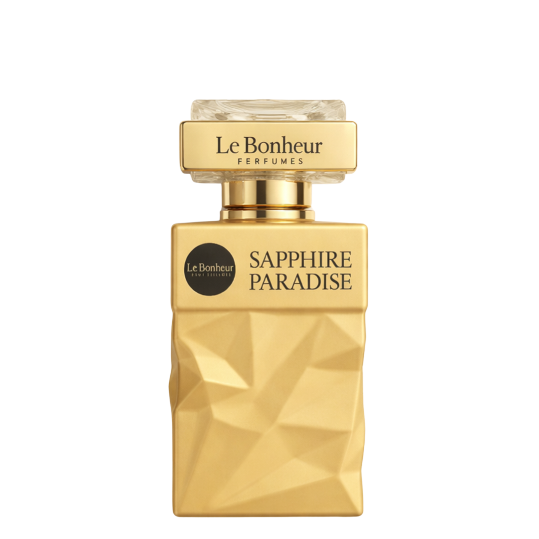 Gold perfume bottle labeled 'Sapphire Paradise' by Le Bonheur on a white background