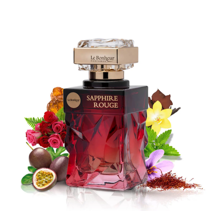 Perfume bottle labeled 'Sapphire Rouge' by Le Bonheur with floral and fruit elements on a white background