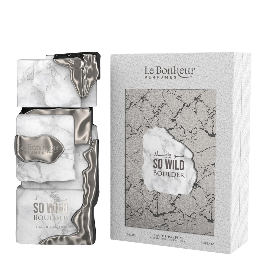 Le Bonheur Parfums So Wild Boulder Eau de Parfum, showing the stacked marble and metallic liquid bottle on the left and its textured grey packaging box on the right.