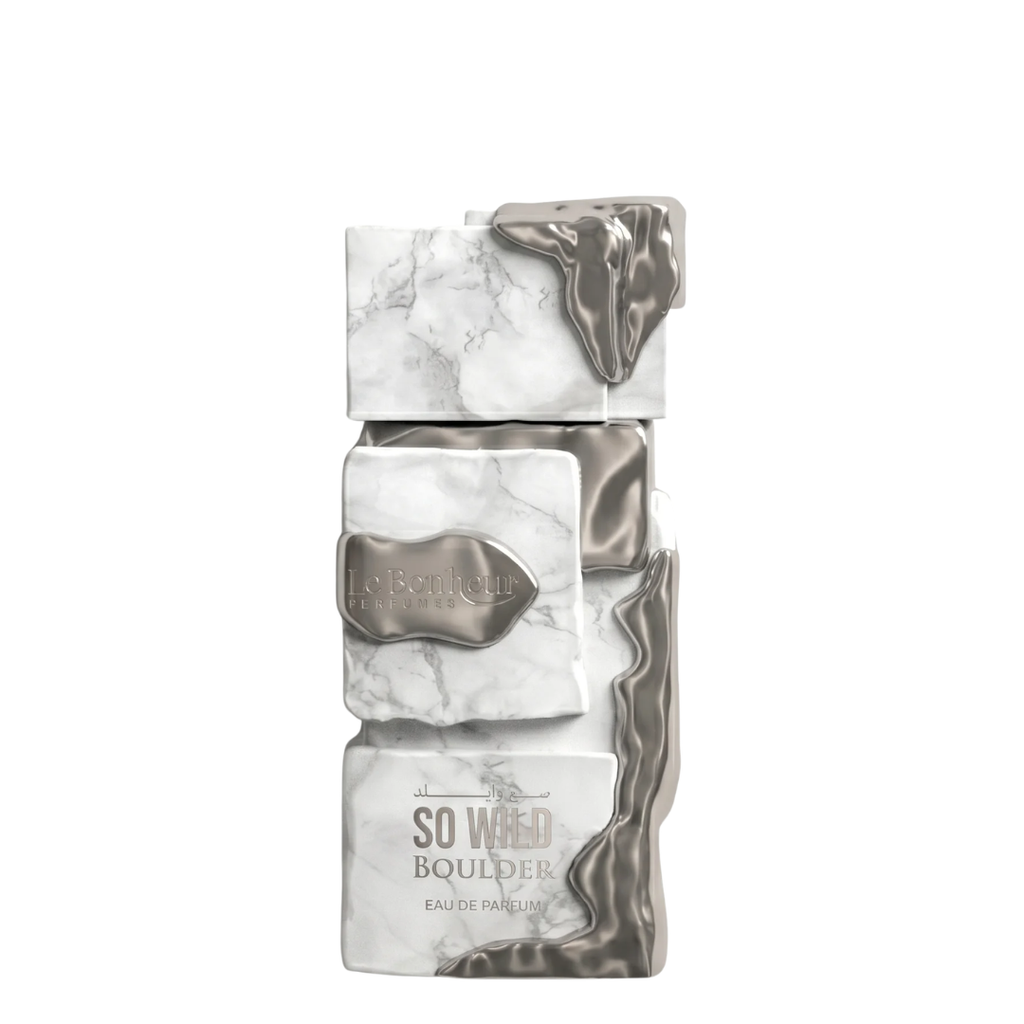 A rectangular perfume bottle with a stacked marble and metallic silver design, featuring the text 'So Wild Boulder' and 'Eau de Parfum'. Le Bonheur: So Wild Boulder.