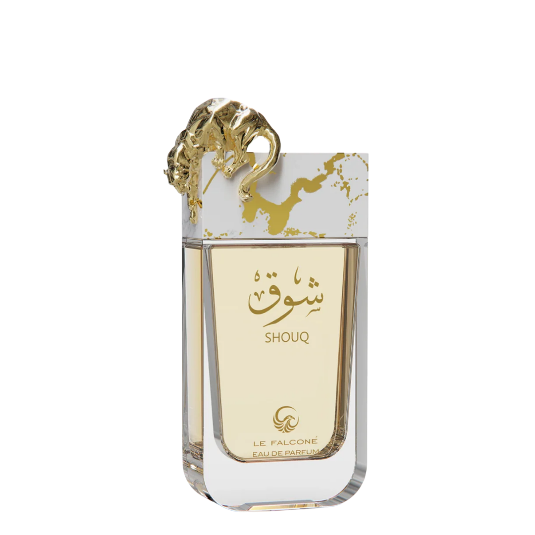 Perfume bottle labeled 'Shouq' with gold accents on a white background