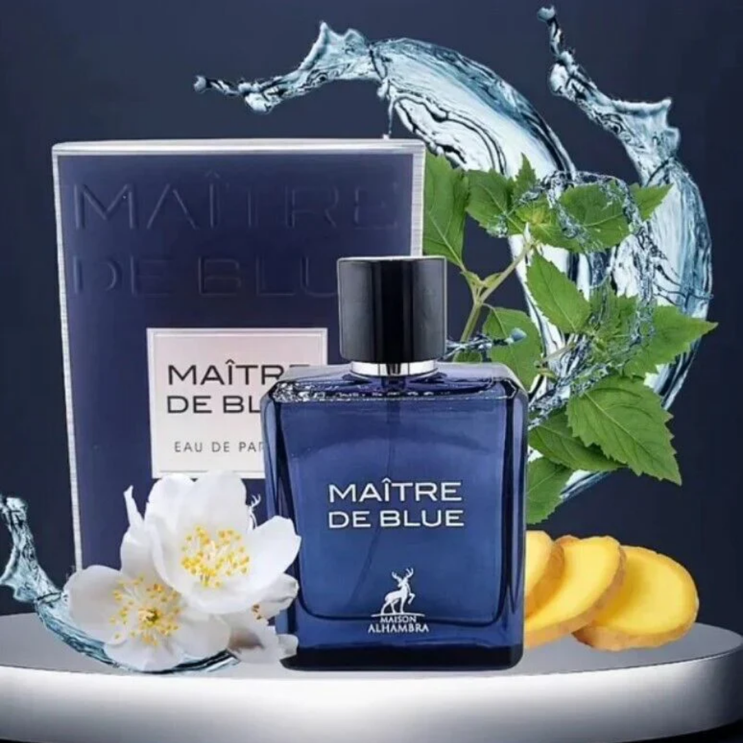 Blue perfume bottle labeled 'Maitre de Blue' with packaging and flowers on a dark background