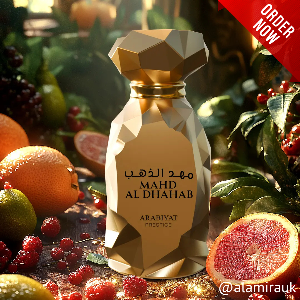 Decorative bottle labeled 'MAHD AL DHAHAB' surrounded by fruits and foliage with a 'ORDER NOW' banner. Mahd Al Dhahab by Arabiyat Prestige Unisex Perfume