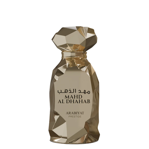 A glass perfume bottle with a faceted design, containing Mahd Al Dhahab fragrance by Arabiyat Prestige.