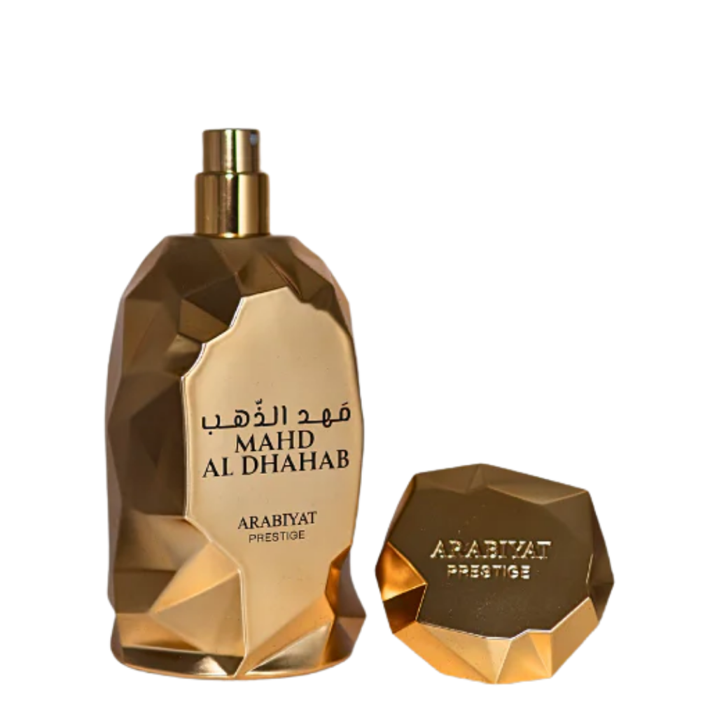 Gold perfume bottle and cap on a white background. Mahd Al Dhahab by Arabiyat Prestige Unisex Perfume