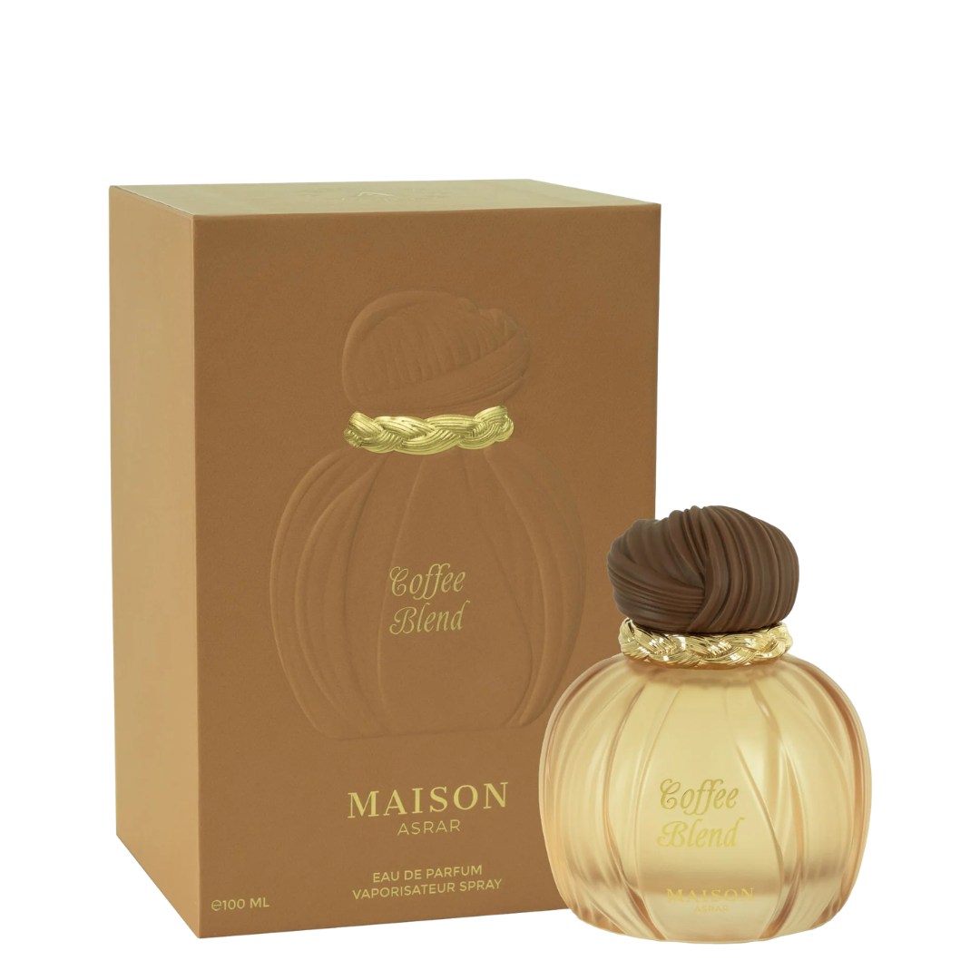 Maison Asrar Coffee Blend Eau de Parfum bottle with a ribbed amber glass body, dark brown textured cap, and gold accents, shown next to its brown cardboard packaging box on a white background.