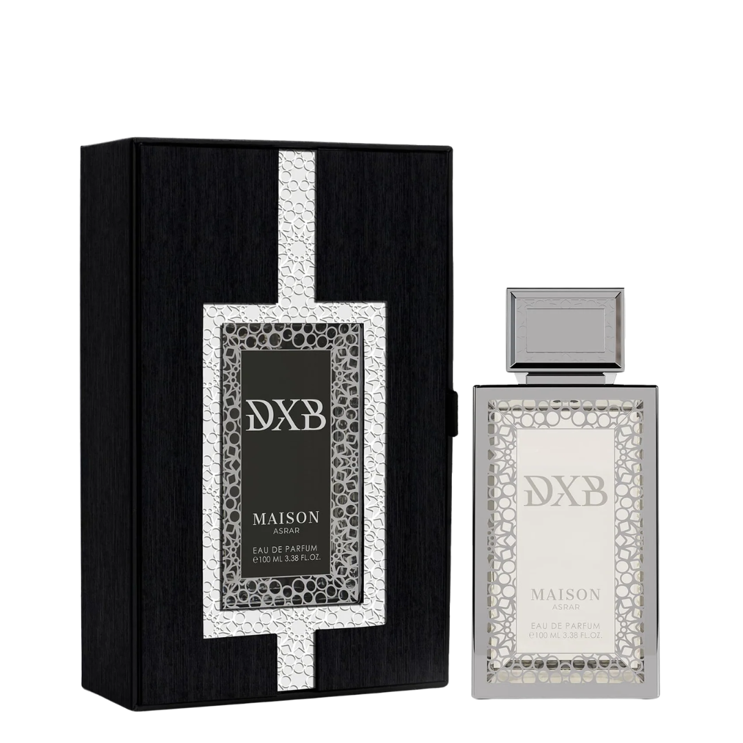 Maison Asrar DXB Eau de Parfum shown with its black presentation box and the clear rectangular perfume bottle with a silver cap on a white background.