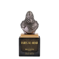 Maison Asrar Faris Al Arab Eau de Parfum, featuring a metallic bust of a veiled figure on a gold-plated base, set atop a black rectangular marble plaque with gold lettering.